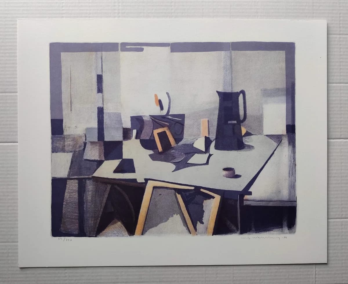 A still life in a room, seen from a raised angle. A dark jug, a small cup and a leaning framed picture stand on a pale table, surrounded by angular forms in violet, blue-grey and white with touches of orange and yellow.