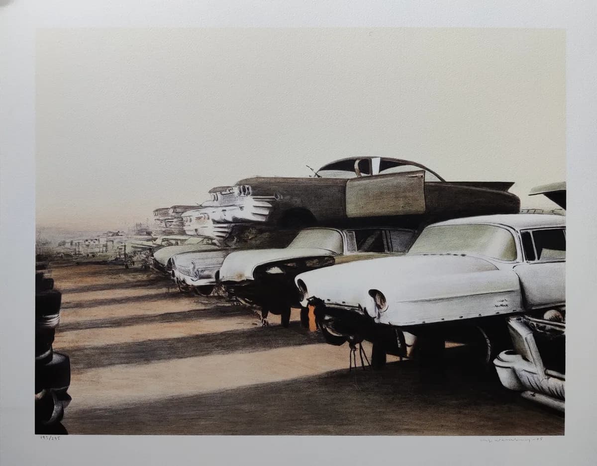 Junkyard filled with classic cars.