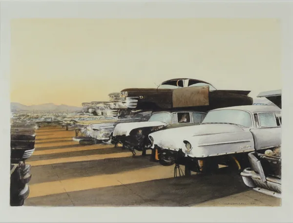 Junkyard filled with classic cars.